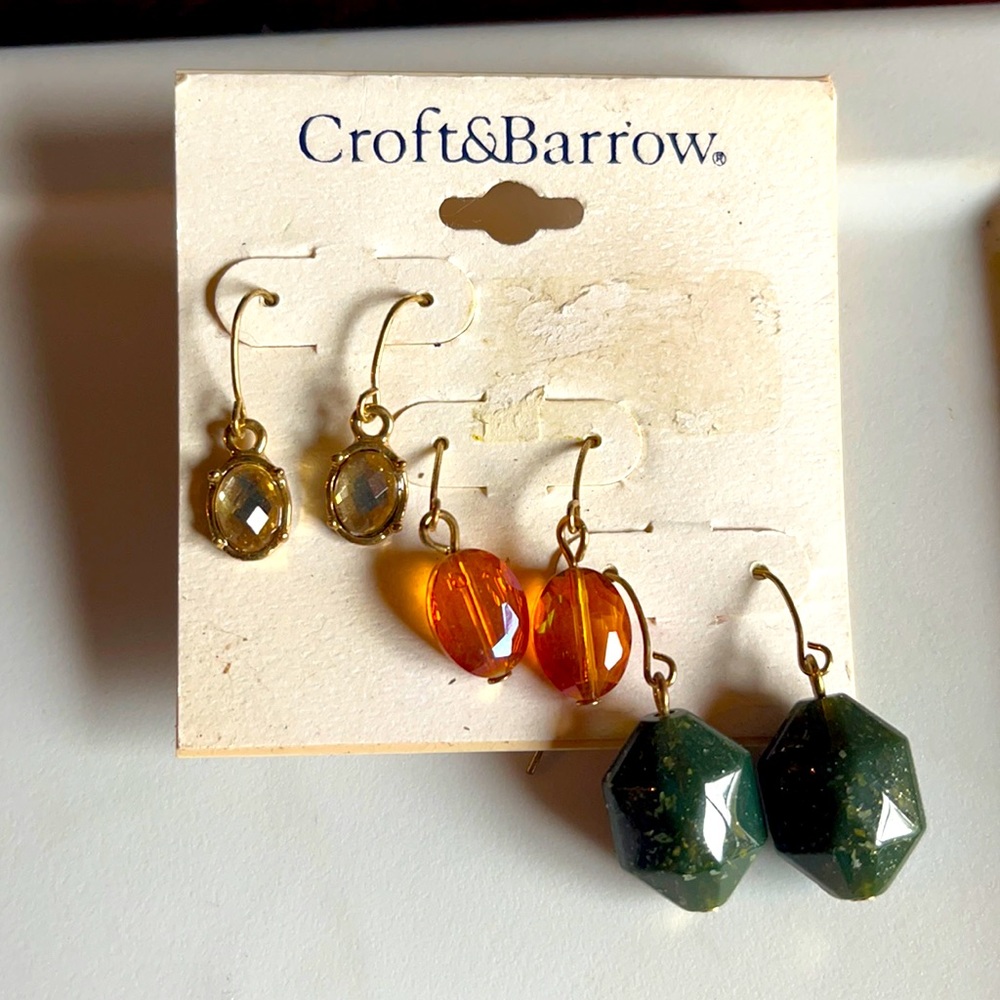 Three pair of earrings in fall colors. Gold, orange and green with gold flecks.